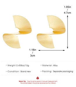 Detail showing dimensions and material of golden alloy spiral pleated drop earrings