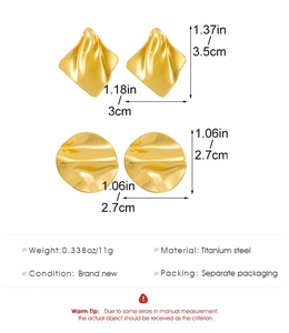 Detailed view of geometric irregular wavy gold earrings with specific size measurements