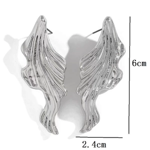 Irregular silver textured metal earrings with lava fold design, 6cm high by 2.4cm wide