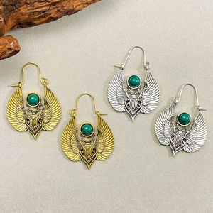 Vintage Egyptian scarab wing earrings with green gemstones in gold and silver finish