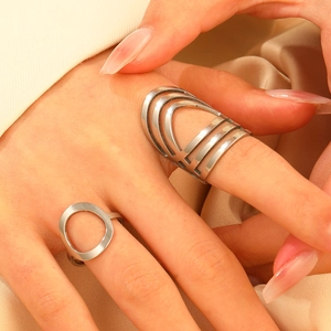 Polished silver hollow geometric wide ring and minimalist band on model hand