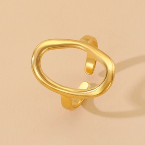 Detail of the hollow oval gold-plated ring with adjustable open band minimalist style