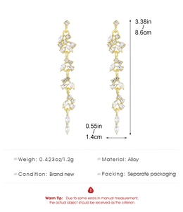 Detail showing dimensions of long zircon leaf tassel earrings in gold alloy finish