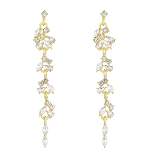 Detail view of gold flower earrings with sparkling rhinestones and cascading tassels