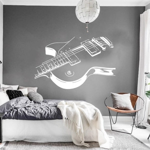 Sticker mural guitare blanc minimaliste comme grande pièce décorative au-dessus d'un lit