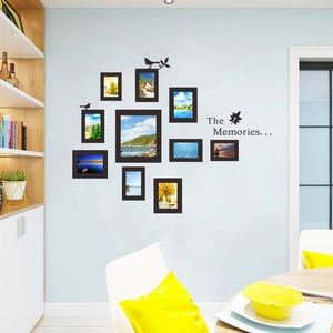 Detail of 10-piece black photo frame set with bird and leaf wall decals for living room
