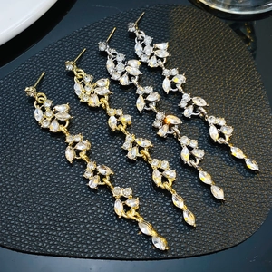 Luxurious flower tassel earrings with crystals in gold and silver finish for wedding events