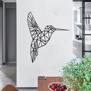 Detail of minimalist black geometric hummingbird wall sticker in a modern dining room