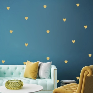 Golden heart wall stickers for kids room decor, minimalist geometric patterns on blue wall