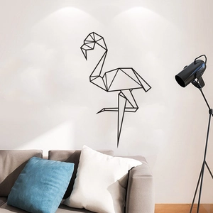 Modern geometric flamingo wall sticker art above a grey sofa in a minimalist living room