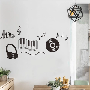 Detail of music theme wall stickers with piano keys and headphones on a white wall