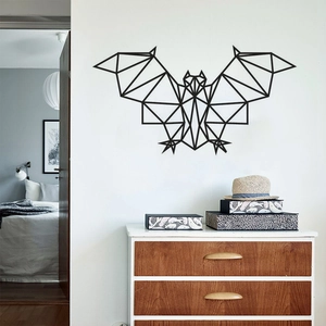Detail of geometric bat wall decal above a wooden cabinet in a modern home interior