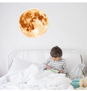 Luminous moon wall decal showing realistic crater texture for a cozy bedroom ambiance