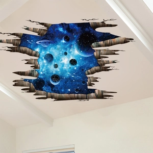 Macro detail of 3D galaxy ceiling sticker showing deep blue cosmos through broken wall effect