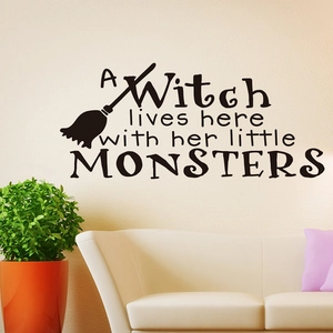 Halloween wall decal featuring A Witch lives here text and broomstick silhouette