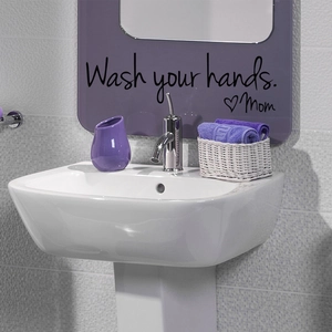 Detail of Wash your hands Mom vinyl wall sticker on a bathroom mirror and wall surface