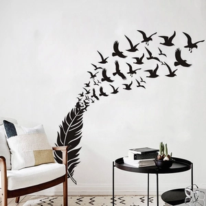 Minimalist black feather and flying birds wall decal in modern living room decor