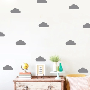 Adhesive grey cloud wall stickers applied to a white wall for kids room decoration