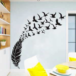 Detail of creative feather transitioning into flying birds matte black vinyl wall decal