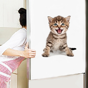 Detail of 3D cartoon brown tabby kitten wall sticker applied on white refrigerator surface