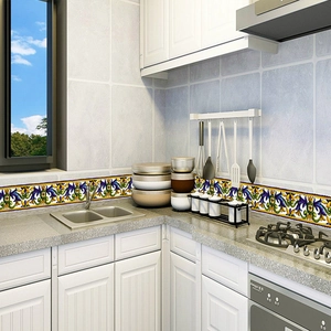 Mediterranean floral tile stickers applied as a waterproof waistline border on kitchen walls