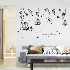 Modern black birdcage wall decals featuring leaf silhouettes and elegant English quotes