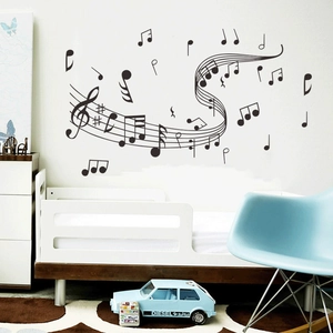 Musical notes and staff wall decal in a nursery room with a clean minimalist design