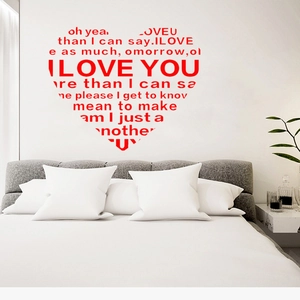 Detail view of heart-shaped wall sticker with red I LOVE YOU artistic text decoration