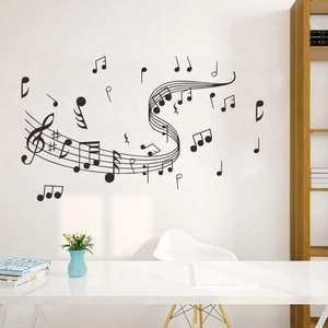 Detailed view of black musical notes and staff wall decal in a modern office study setting
