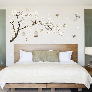 Detailed close-up of Magnolia flower wall decal with birds and vintage birdcage elements