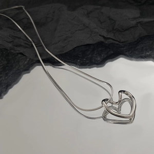 Minimalist double layer silver stainless steel necklace with a hollow heart pendant