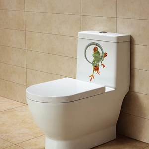 Funny red-eyed tree frog wall sticker with magnifying glass on a white toilet tank