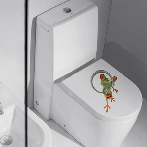 Close-up of a 3D funny tree frog sticker with a magnifying glass on a toilet lid