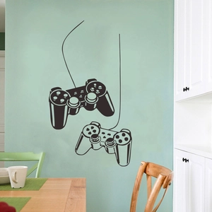 Black game controller wall sticker on a green wall with modern home decor