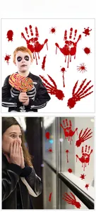 Macro view of Halloween blood handprint and skeleton bone stickers on a glass window