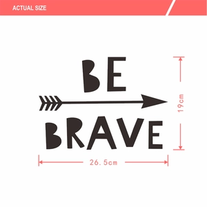 Macro detail of BE BRAVE vinyl wall decal showing 26.5cm width and arrow design