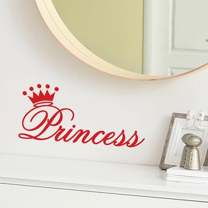 Close-up of red vinyl Princess crown wall sticker on a white clean bedroom wall