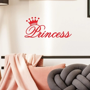 Detail of red Princess wall sticker with crown icon on a cozy bedroom headboard
