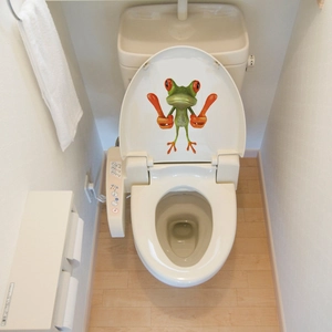 Creative 3D green frog toilet lid decal featuring a funny cartoon character giving thumbs up