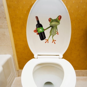 Detail view of 3D cartoon frog sticker on toilet lid with vivid green color