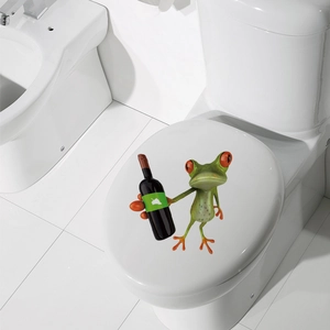 Detailed 3D cartoon green frog sticker with a bottle applied on a white toilet lid