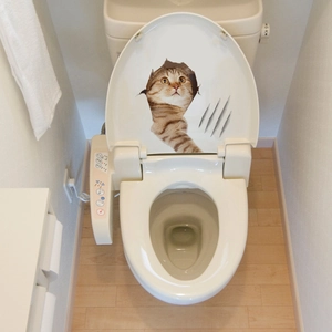 3D realistic orange tabby cat sticker with scratch marks on white toilet lid surface