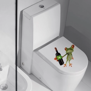 Detailed view of 3D funny green frog wall sticker holding a bottle on a white toilet lid