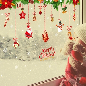 Detail showing cartoon Santa, snowman, and stars on PVC Christmas window decals