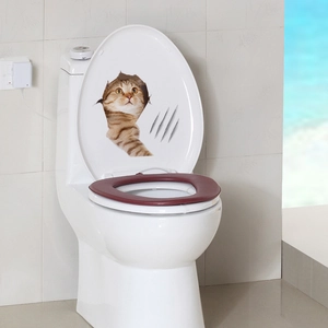 3D cat toilet sticker with orange tabby kitten peeking through a crack and claw marks