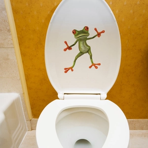 3D realistic red-eyed tree frog sticker applied to a white ceramic toilet cover lid