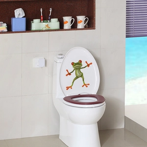 3D red-eyed tree frog decorative wall sticker on a white toilet lid for bathroom decor