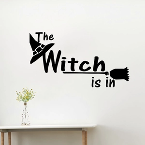 Halloween wall decal featuring The Witch is in phrase with a hat and broom design