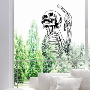 Halloween wall sticker showing a skull barber holding a razor on a glass window surface