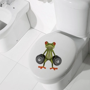 Detailed view of a funny 3D cartoon green frog lifting dumbbells as a toilet lid sticker